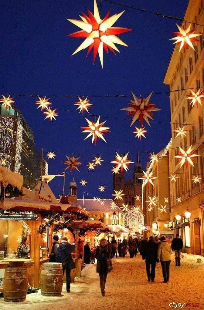 Christmas Market with hanging Moravian Stars decorations in Magdeburg, Germany. 